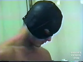 Sexy masked feeder uses the toilet boy